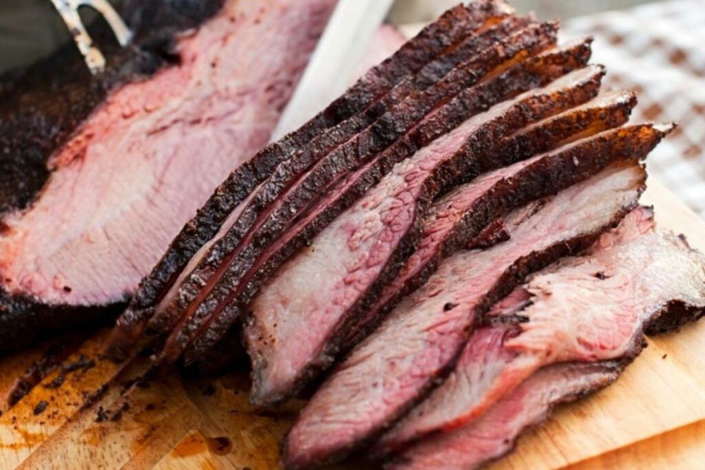 Slicing grilled brisket